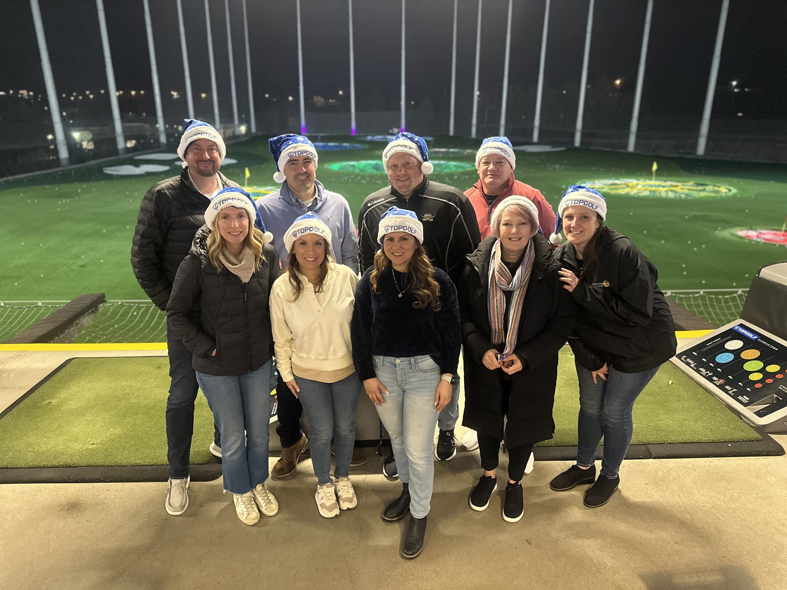 Melissa Grimes with her team members at Top Golf.