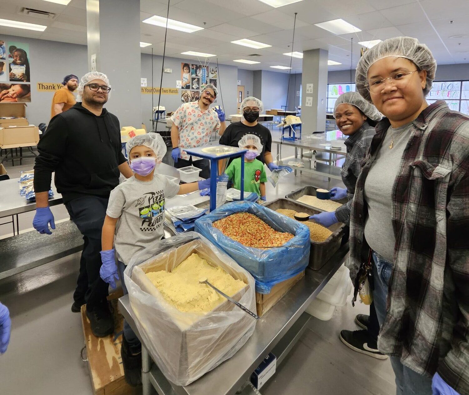 Maya Beville and her colleagues packaging food for those in need.